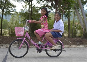 Two girls on a bike