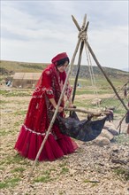 Qashqai woman shaking goat milk to make cheese
