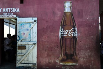 Coca Cola advertising and the open door of a restaurant