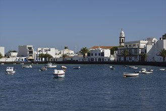 Redesigned harbour of El Charco de San Gines with the church Iglesia de San Gines