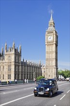 Black cab on Westminster Bridge with Big Ben and the Houses of Parliament