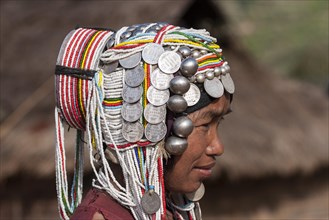 Elderly woman of the Akha ethnic group with traditional headdress