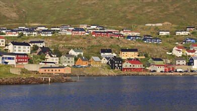 Colorful wooden houses on Porsangerfjord