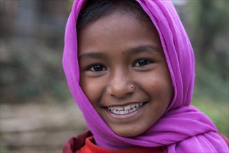 Smiling Nepalese girl with purple headscarf