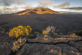 Sunset with clouds over the crater of the Piton de la Fournaise volcano
