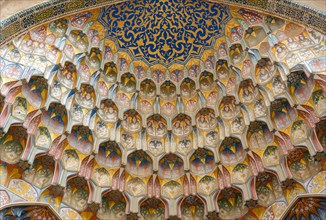 Decorative muqarnas vaulting in the iwan entrance of Abdulaziz Khan Madrassah