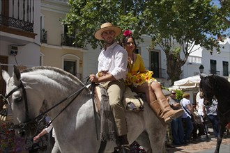 Man and woman on a horse