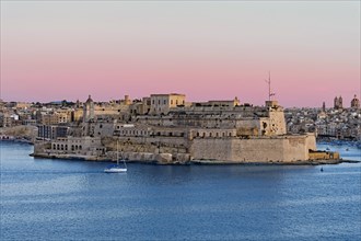 View from Valletta of the fortress Fort St. Angelo in the centre of the Grand Harbour