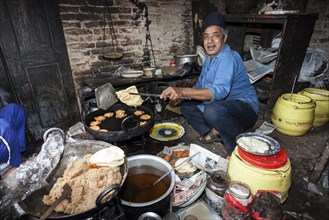 Nepalese man producing fried food