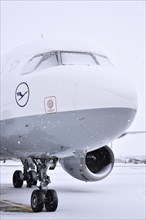 Lufthansa Airbus A 320-200 aircraft in parking position in the snow
