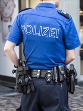 Female Swiss police officer in uniform with equipment