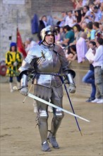 Knight in armor at the parade before the historical horse race Palio di Siena
