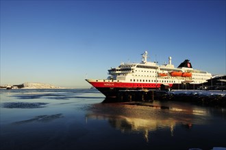 The Hurtigruten post ship MS Nordlys docked in the port of Kirkenes
