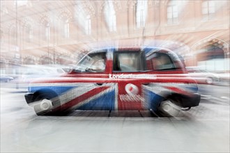 London taxi in the British national colours of the Union Jack