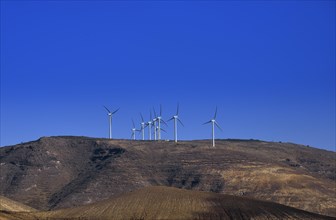 Wind turbines on the Risco de las Nieves range providing energy for the desalination of drinking water