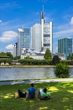 Young people at the Main River overlooking the Commerzbank