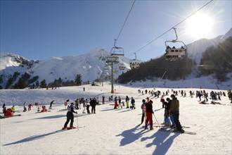 Skiers on the ski slopes at Le Mont Dore ski resort