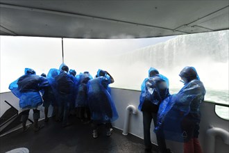 Tourists in raincoats on the tour boat Maid of the Mist