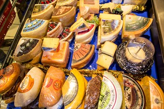 Refrigerated cabinet with various cheeses