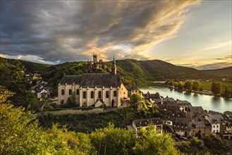 View of the winegrowing village of Beilstein with the castle ruins of Metternich and the Carmelite Church in the evening light