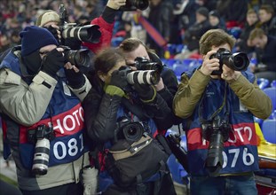 Press photographers at a Champions League football match