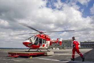 A paramedic running to a rescue helicopter of the DRF air rescue