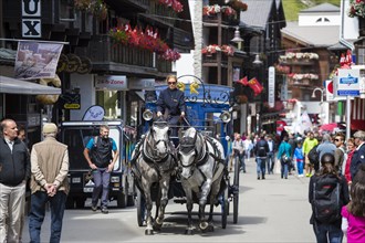 Horse-drawn carriage in Zermatter Bahnhofstrasse street