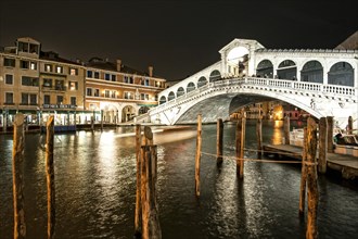 Dock on the Grand Canal at the Rialto bridge by night