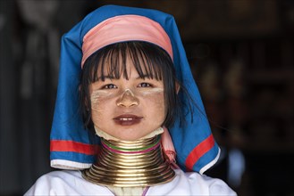 Girl of the Padaung ethnic group wearing traditional clothing