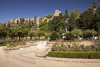 Gardens of Jardines de Pedro Luis Alonso with Alcazaba Fortress at the rear