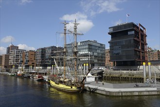 A historic tall ship is moored in the Tall Ship Harbour