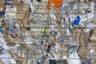 Pressed waste paper and cardboard