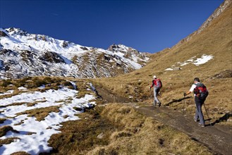 Mountain climbers ascending Wilde Kreuzspitze Mountain in the Pfunderer Mountains