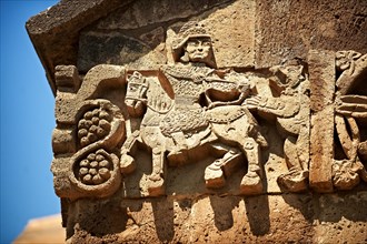 Bas-relief sculpture of a hunter in armour shooting an animal on the outside of the 10th century Armenian Orthodox Cathedral of the Holy Cross on Akdamar Island