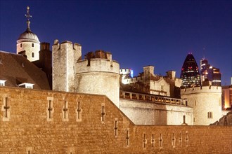 Tower of London at dusk in front of the Swiss Re Tower