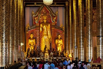 Worshipers praying in the temple of Wat Chedi Luang