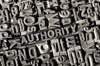 Old lead letters forming the word 'AUTHORITY'