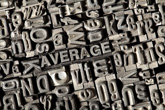 Old lead letters forming the word "AVERAGE"