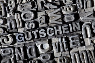 Old lead letters forming the word GUTSCHEIN