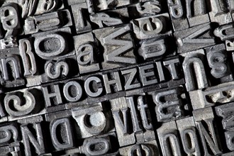Old lead letters forming the word HOCHZEIT