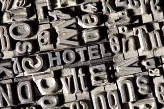 Old lead letters forming the word HOTEL