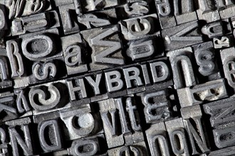 Old lead letters forming the word HYBRID