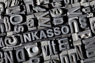 Old lead letters forming the word 'INKASSO'