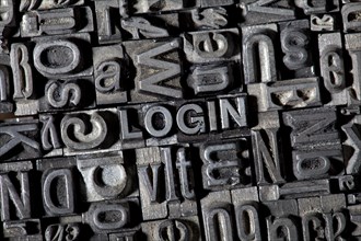 Old lead letters forming the word "LOGIN"