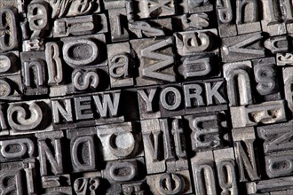 Old lead letters forming the word 'NEW YORK'
