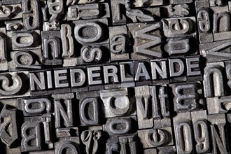 Old lead letters forming the word NIEDERLANDE