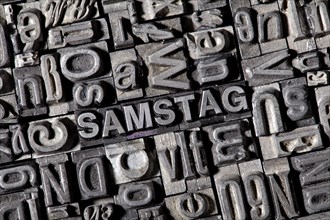 Old lead letters forming the word SAMSTAG