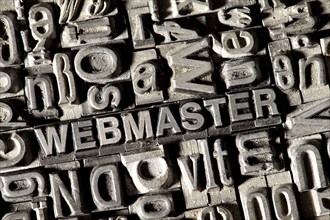 Old lead letters forming the word WEBMASTER
