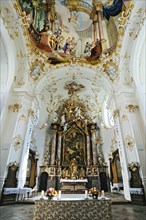 Altar and ceiling frescoes in the church