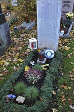 Child's grave with football on the Ostfriedhof or East Cemetery